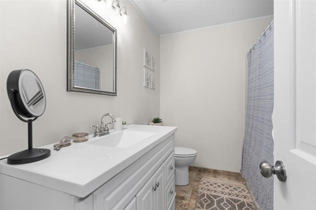 10 Cumberland Drive Southeast Rome, GA 30161 - Photo 23 of 33 a bathroom with a sink and a mirror