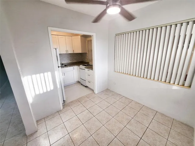 a view of a utility room with windows