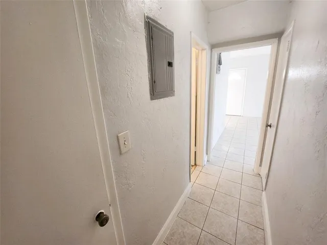 a bathroom with a glass door shower