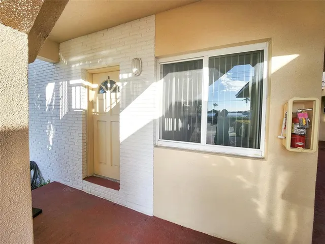a view of a large room with windows