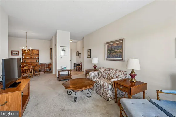 a room with furniture pool table and window