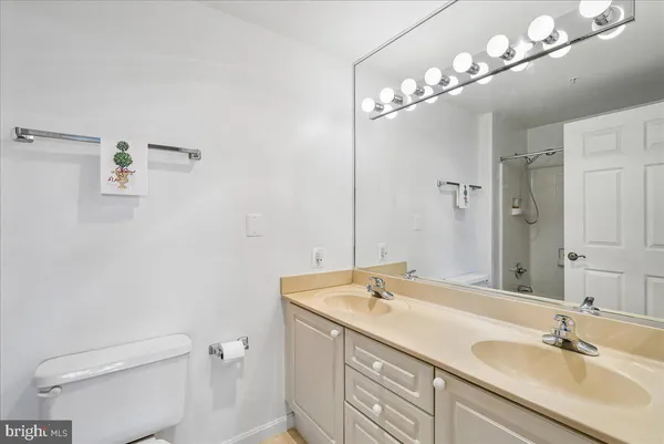 a bathroom with a shower and a bath tub