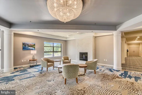 a living room with lots of furniture and a wooden floor
