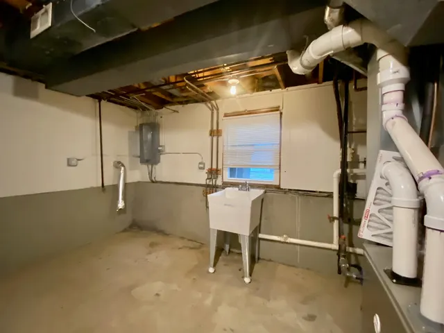 a view of a porch with wooden floor and outdoor seating