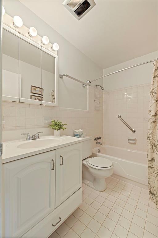 8221 112th Street North, Unit 203 Seminole, FL 33772 - Photo 20 of 31 a bathroom with a sink a toilet and shower