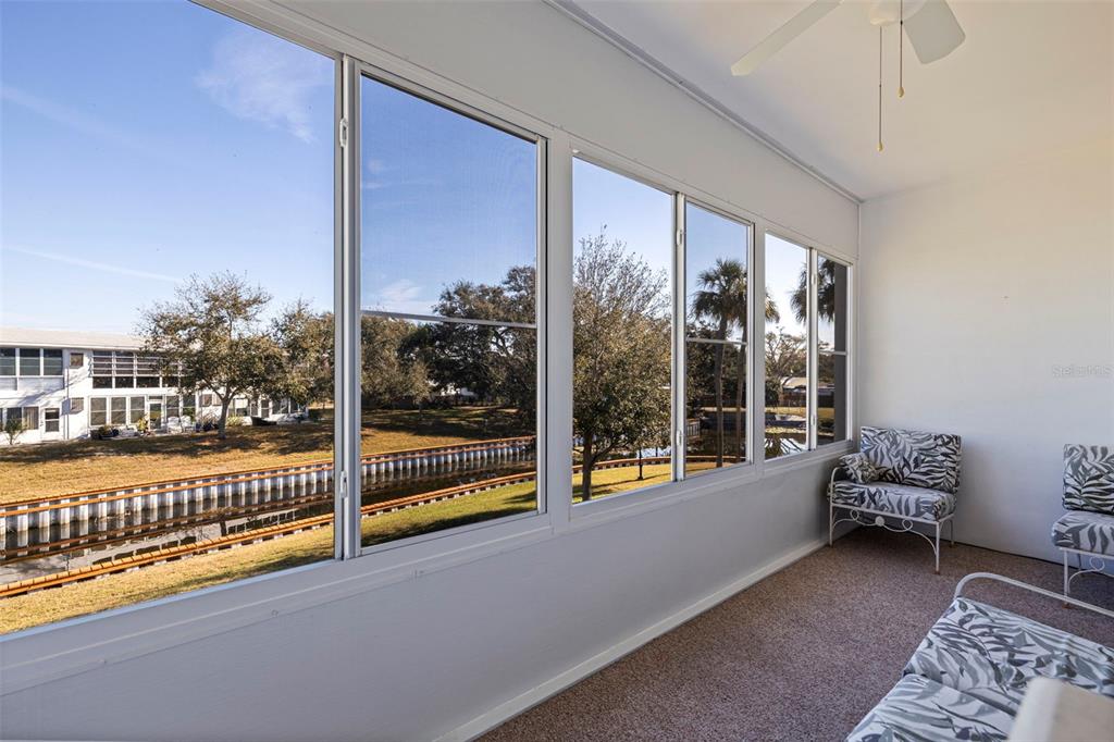 8221 112th Street North, Unit 203 Seminole, FL 33772 - Photo 25 of 31 a view of a room with a large window and couch