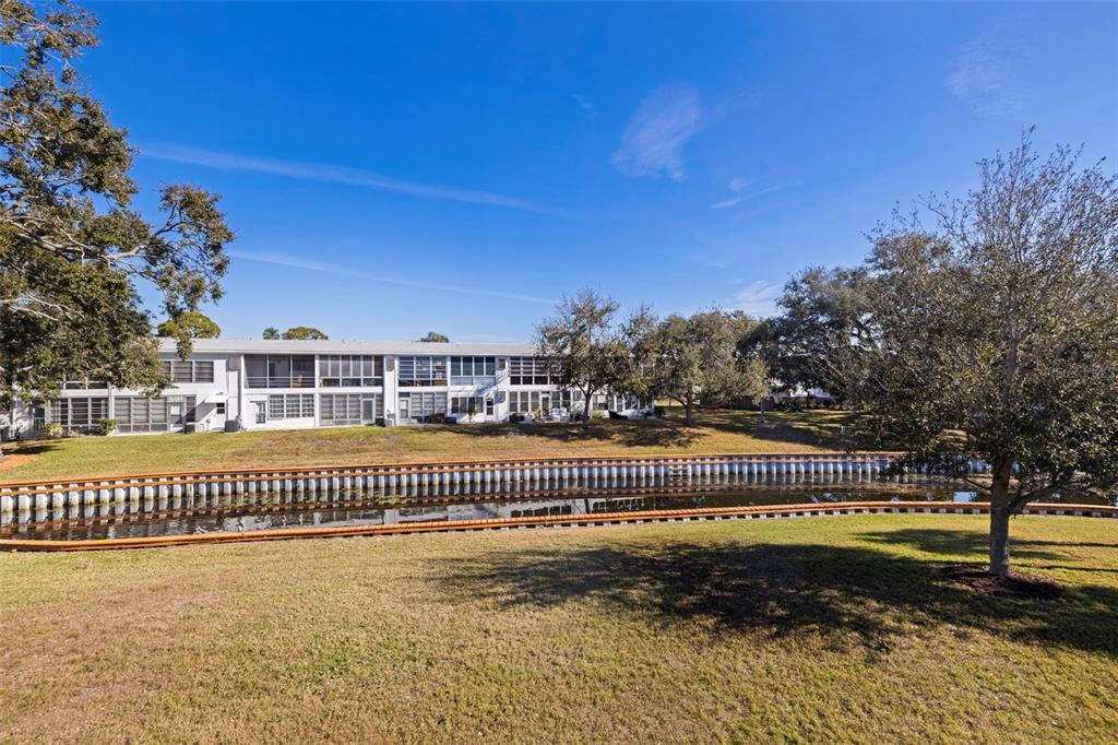 8221 112th Street North, Unit 203 Seminole, FL 33772 - Photo 26 of 31 a view of a house with a swimming pool