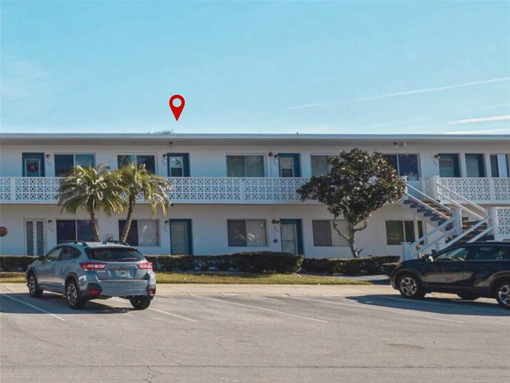 8221 112th Street North, Unit 203 Seminole, FL 33772 - Photo 31 of 31 a car parked in front of a house