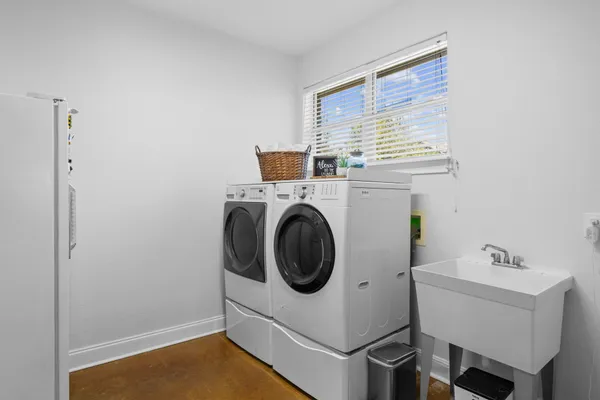 a utility room with dryer and washer