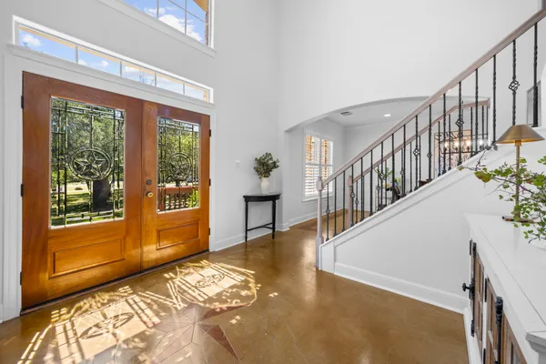 a view of an entryway with wooden floor