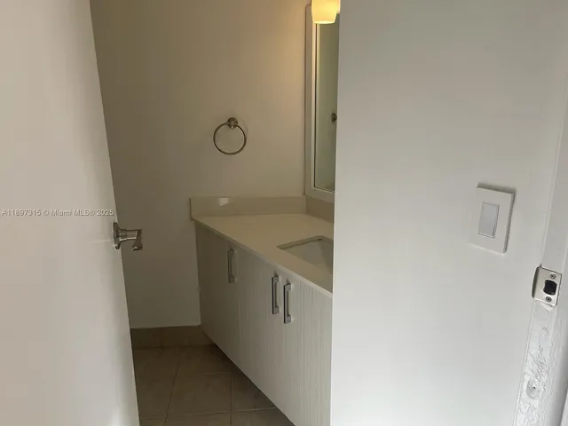 a view of front door with wooden floor