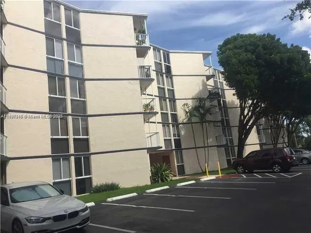 a building exterior with stairs and furniture