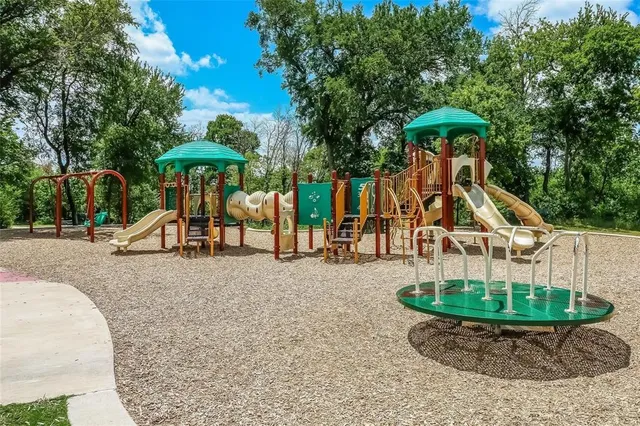 a table and chairs under an umbrella