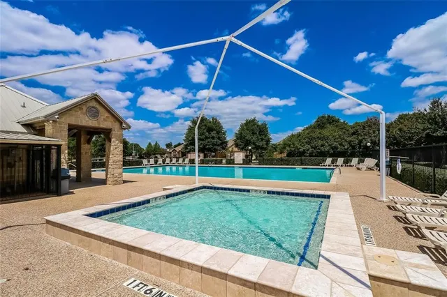 a view of a house with swimming pool