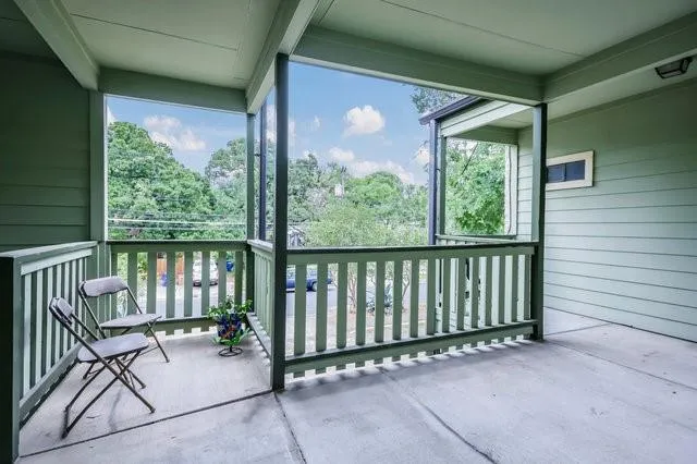 a view of a patio with a table and chairs
