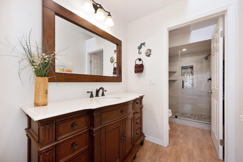6902 Monticello Court Citrus Heights, CA 95621 - Photo 28 of 56 a bathroom with a sink and a mirror