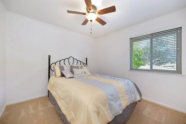 a view of a two chairs in the balcony