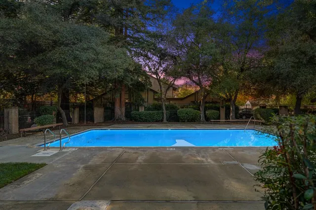 a front view of a house with a yard and a garage