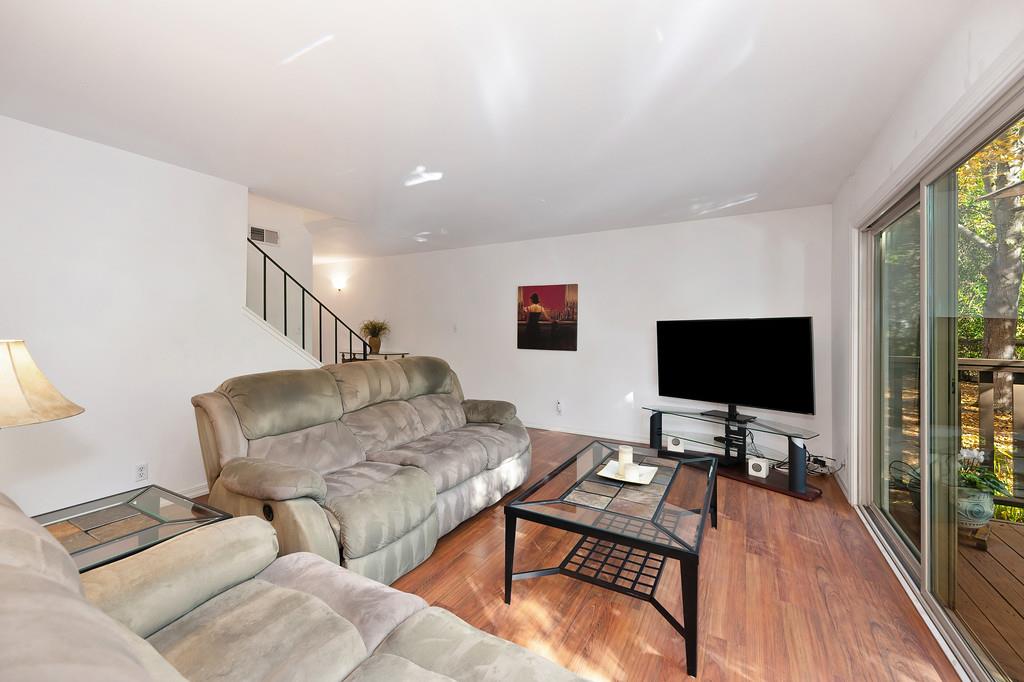 6902 Monticello Court Citrus Heights, CA 95621 - Photo 7 of 56 a living room with furniture and a flat screen tv