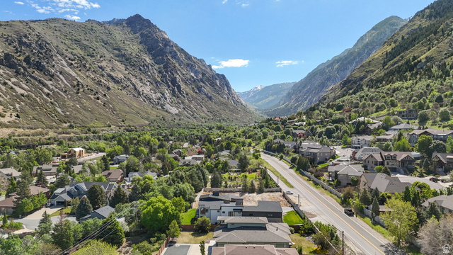 3667 Little Cottonwood Road, Unit 1 Sandy, UT 84092 - Photo 43 of 49 Aerial perspective showcasing a residential community nestled within a mountainous valley