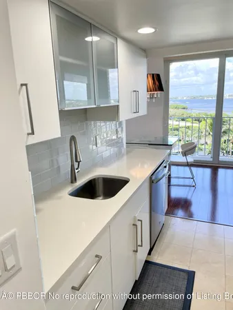 a kitchen with stainless steel appliances a sink and a stove