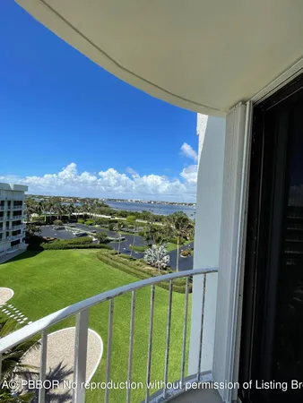 a view of swimming pool from a balcony