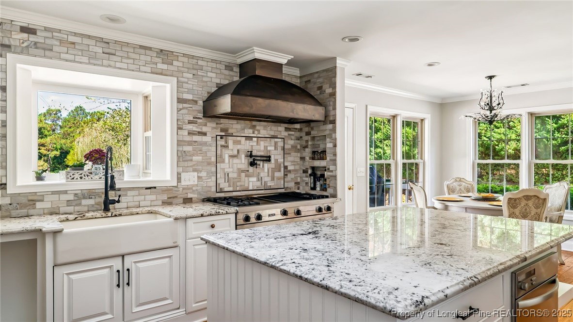 1336 McCaskill Road Carthage, NC 28327 - Photo 15 of 48 a kitchen with stainless steel appliances granite countertop a sink and a counter space