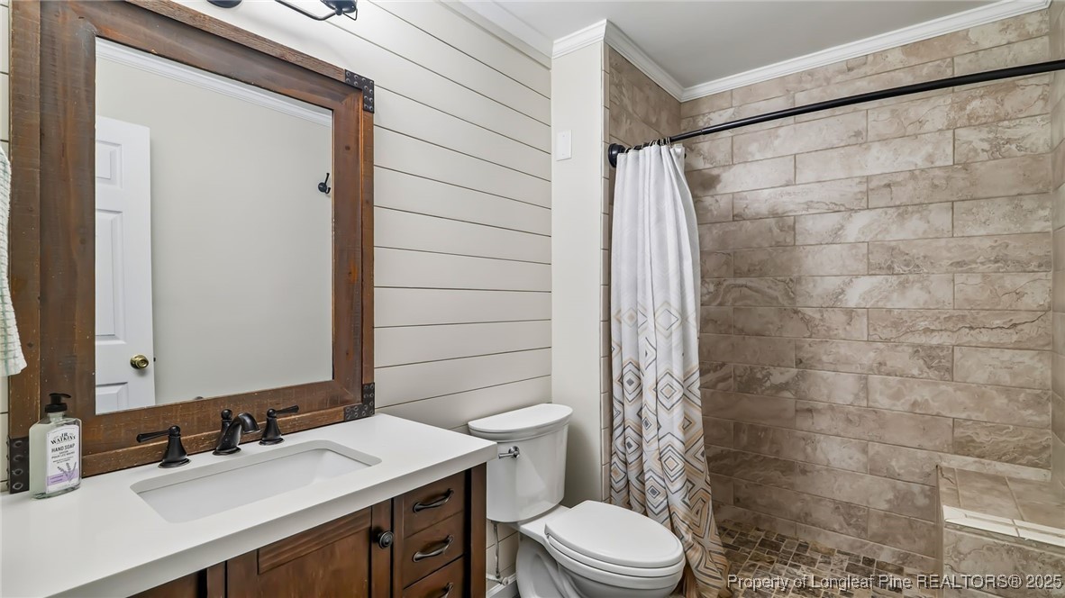 1336 McCaskill Road Carthage, NC 28327 - Photo 33 of 48 a bathroom with a sink a toilet and shower