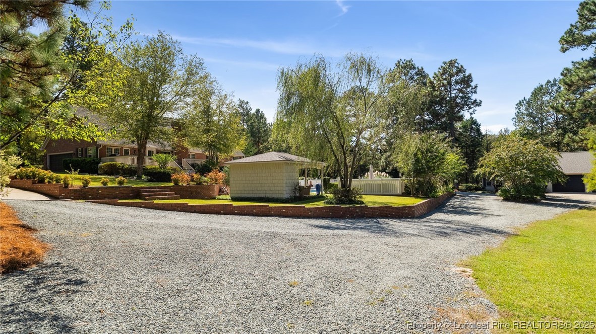 1336 McCaskill Road Carthage, NC 28327 - Photo 41 of 48 a view of a swimming pool with an outdoor space and seating area