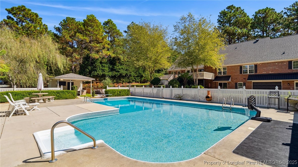 1336 McCaskill Road Carthage, NC 28327 - Photo 5 of 48 a view of a swimming pool with a patio