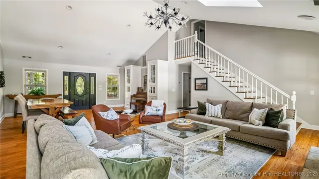 a bathroom with a granite countertop sink a mirror and a shower