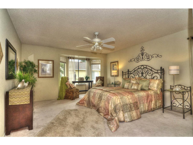 235 Michigan Road Milpitas, CA 95035 - Photo 11 of 24 a bedroom with a large bed and a chandelier