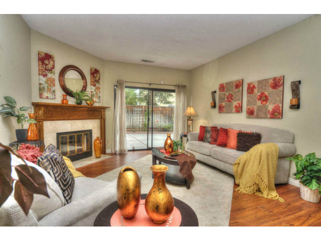 235 Michigan Road Milpitas, CA 95035 - Photo 4 of 24 a living room with furniture a fireplace and a large window
