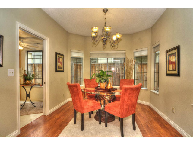 235 Michigan Road Milpitas, CA 95035 - Photo 7 of 24 a view of a dining room with furniture and wooden floor