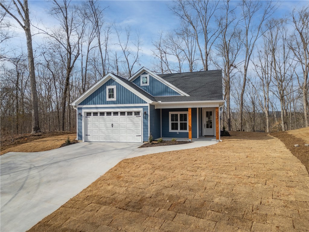 This newly constructed home features a charming exterior with inviting architectural details.