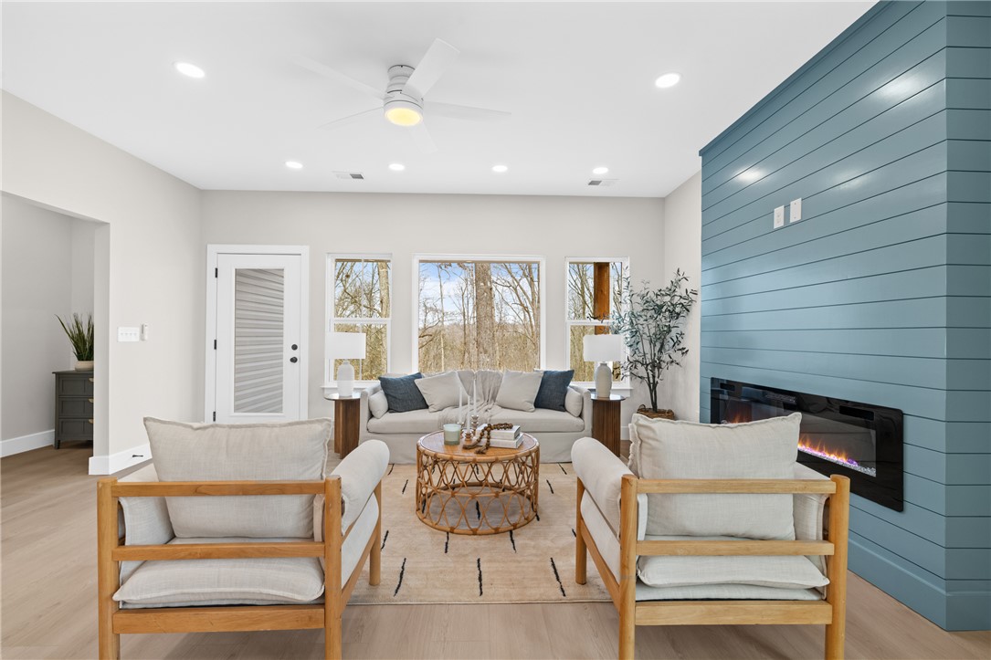 322 Oconee Avenue Westminster, SC 29693 - Photo 10 of 42 This bright living space features abundant natural light, creating an inviting atmosphere.