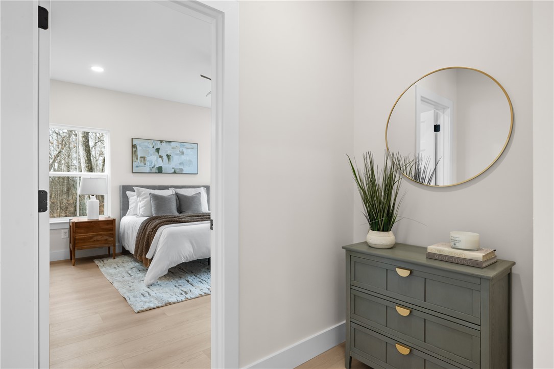 322 Oconee Avenue Westminster, SC 29693 - Photo 12 of 42 This inviting bedroom features natural light and bright, elegant flooring.