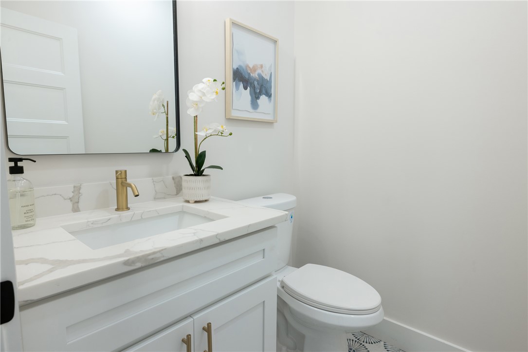 322 Oconee Avenue Westminster, SC 29693 - Photo 21 of 42 This clean and bright bathroom features a vanity with a sleek countertop.