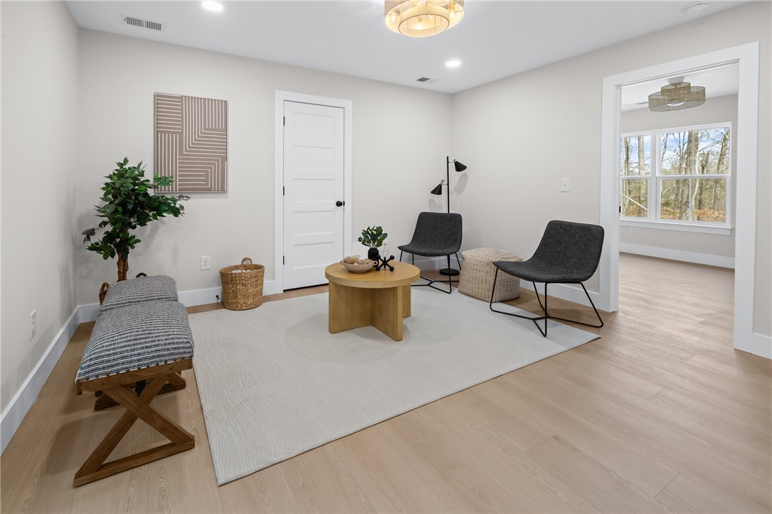 322 Oconee Avenue Westminster, SC 29693 - Photo 23 of 42 This bright and airy living space offers warm wood floors and ample natural light.