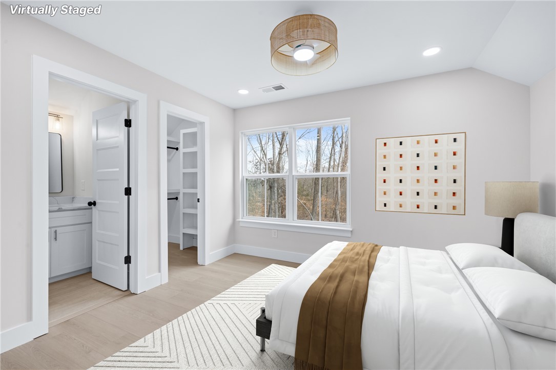 322 Oconee Avenue Westminster, SC 29693 - Photo 26 of 42 This tranquil bedroom offers comfort and a private bathroom, making it an ideal personal retreat.