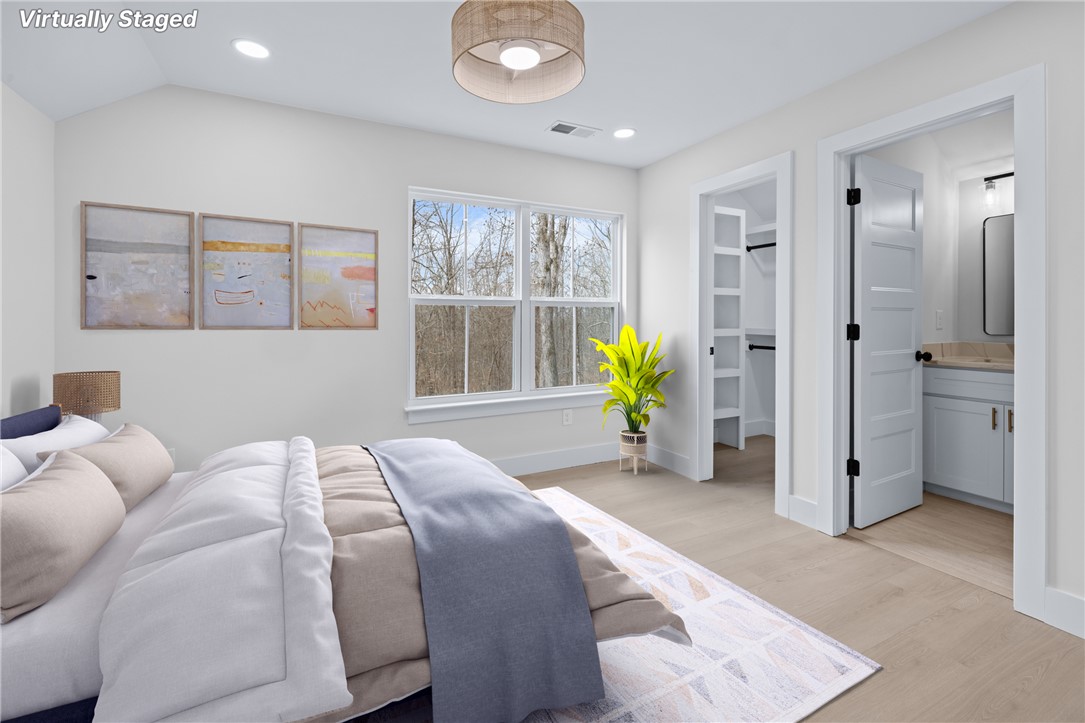 322 Oconee Avenue Westminster, SC 29693 - Photo 29 of 42 This tranquil bedroom offers comfort and a private bathroom, making it a perfect retreat.