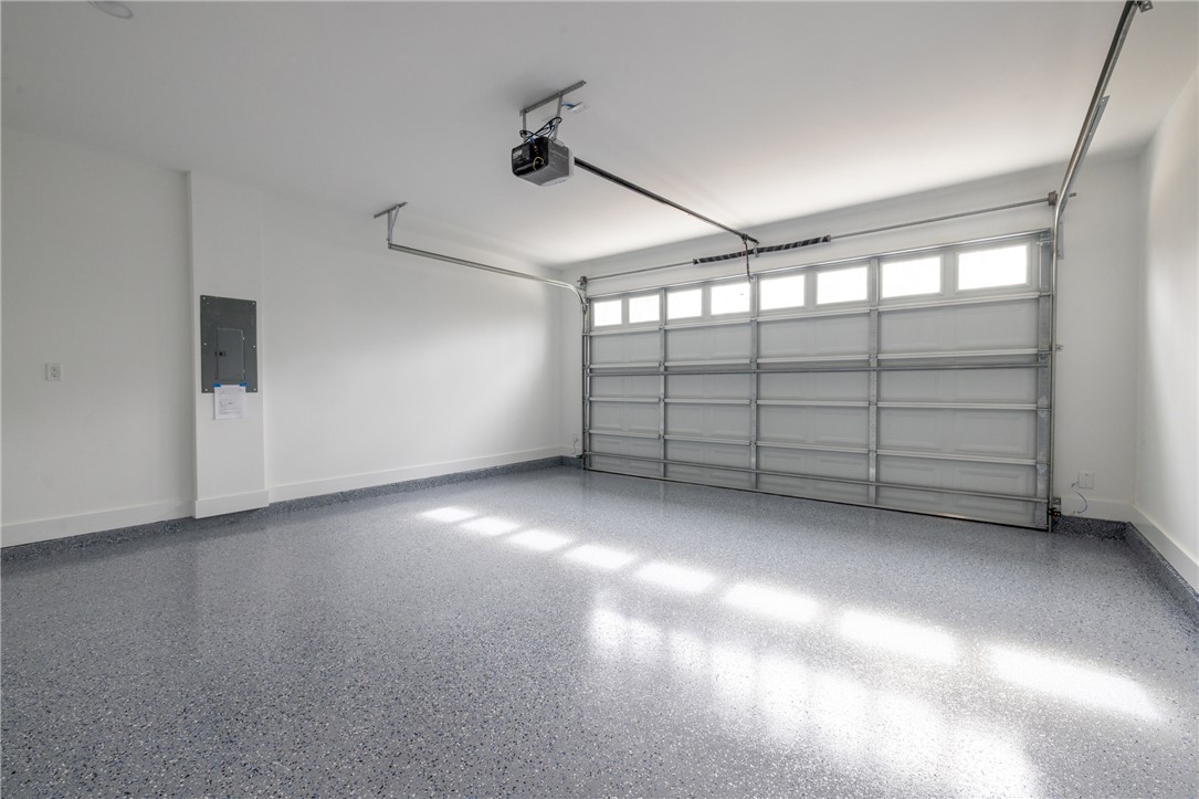 322 Oconee Avenue Westminster, SC 29693 - Photo 31 of 42 This spacious garage offers ample parking and storage with a durable, easy-to-maintain floor.