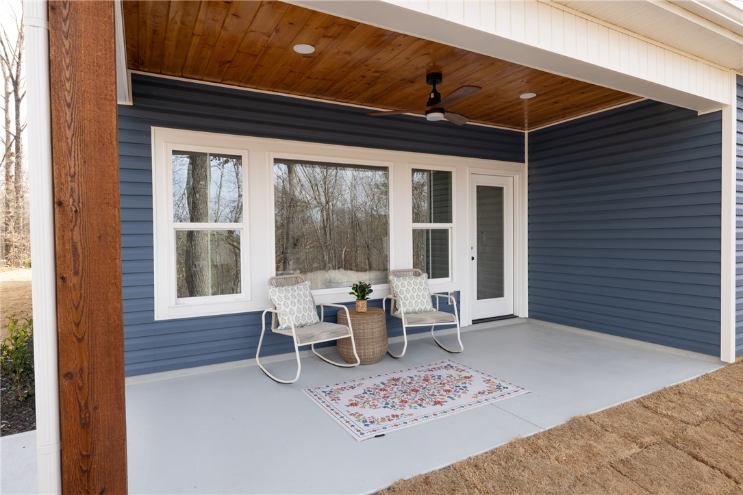 322 Oconee Avenue Westminster, SC 29693 - Photo 33 of 42 This inviting porch, perfect for relaxing, overlooks a serene natural landscape.