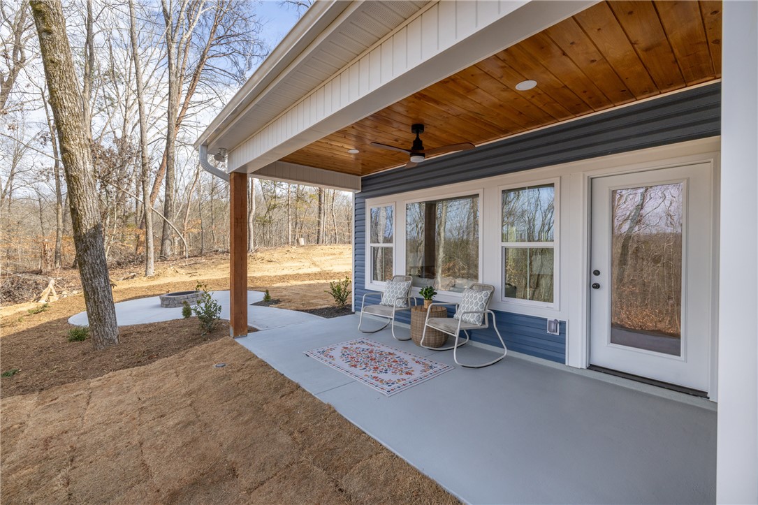 322 Oconee Avenue Westminster, SC 29693 - Photo 34 of 42 This inviting patio offers a serene outdoor space, perfect for relaxation and gatherings.