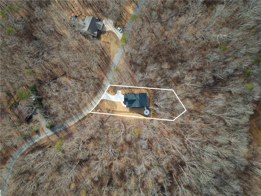 322 Oconee Avenue Westminster, SC 29693 - Photo 36 of 42 An aerial perspective reveals a secluded residence nestled within a vast wooded landscape.