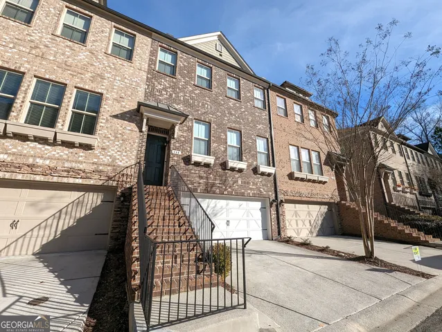 a view of a door and brick wall
