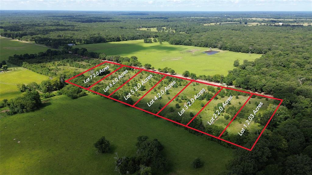 Lot 4 County Road 2470 Alba, TX 75410 - Photo 2 of 7 an aerial view of a golf course with a lake view
