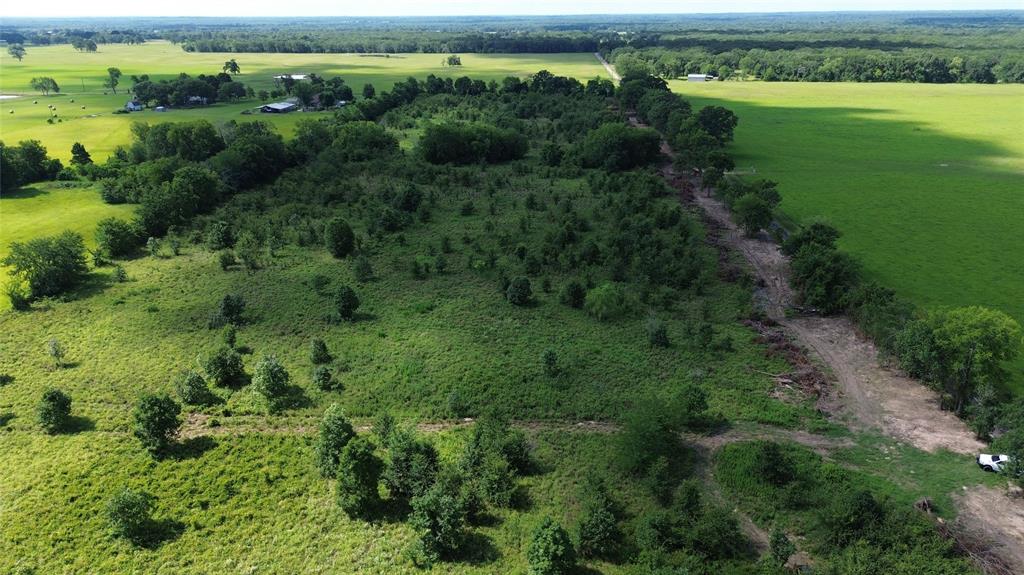 Lot 4 County Road 2470 Alba, TX 75410 - Photo 4 of 7 an aerial view of green landscape with trees houses and lake view