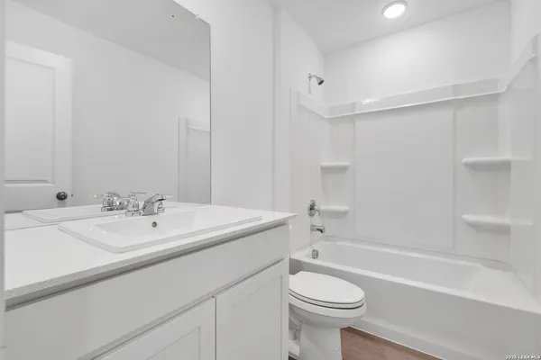 a bathroom with a sink a toilet and a bathtub