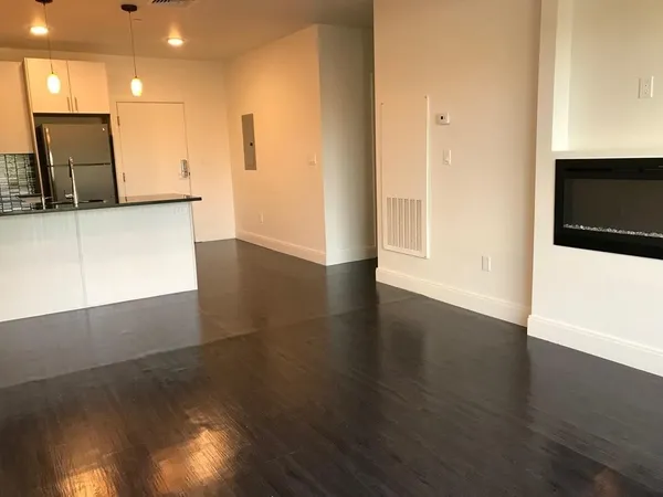 a view of a kitchen with a sink and a microwave